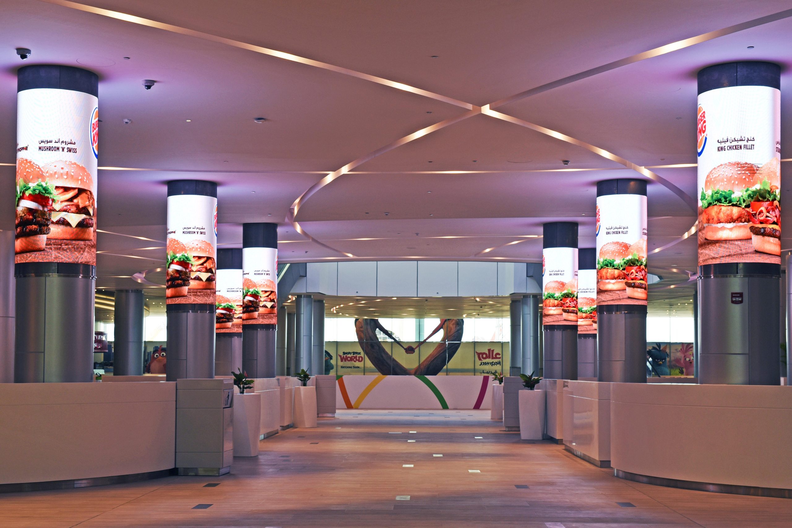 lumos digital screens wrapping around pillars in burger king restuarant