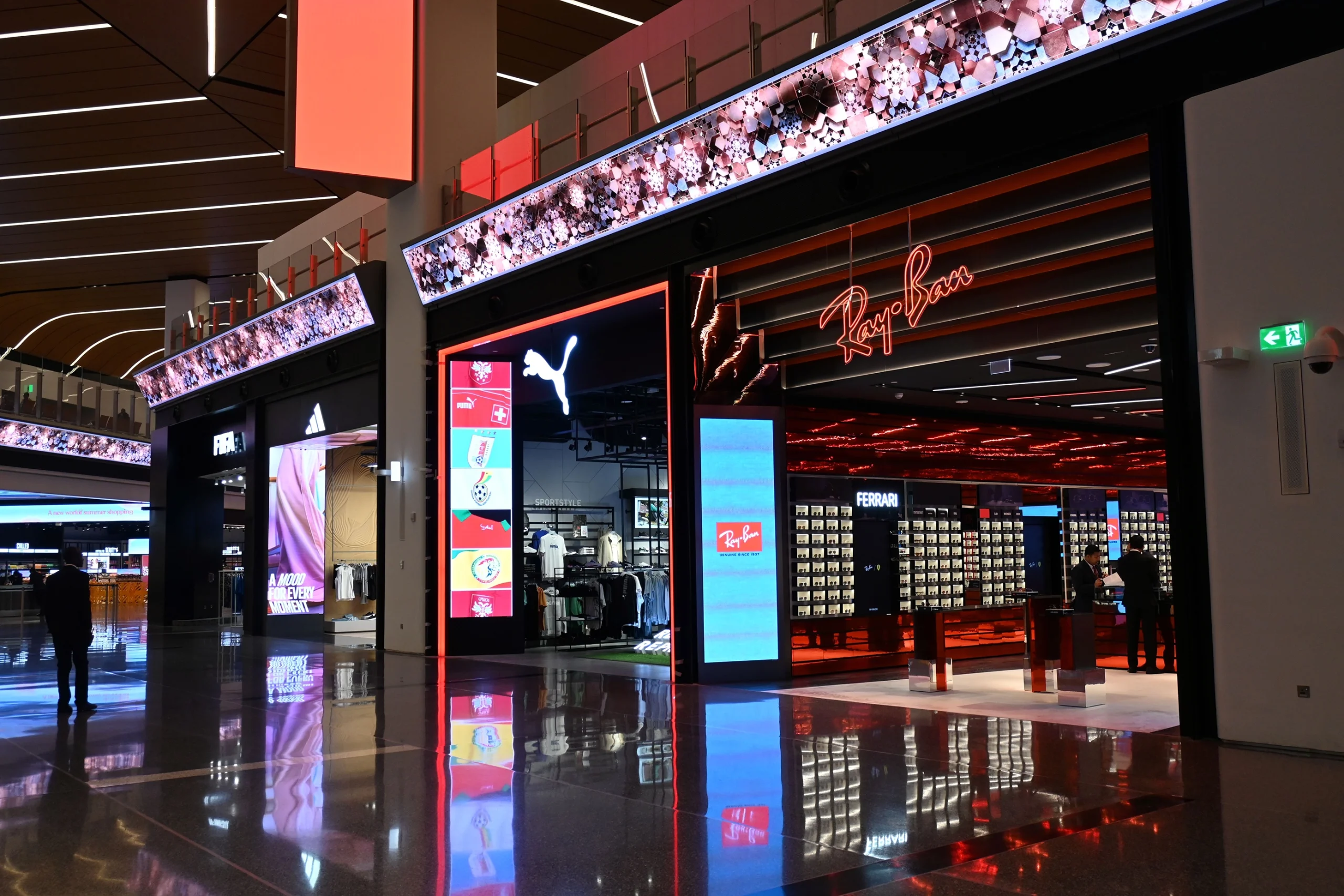 retail digital signage examples in Ray Ban, Puma and Adidas stores, created by Esprit Digital