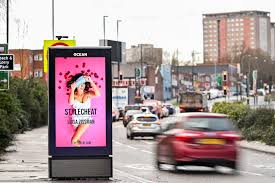 ocean outdoor digital advertising screen alongside a busy road with cars travelling